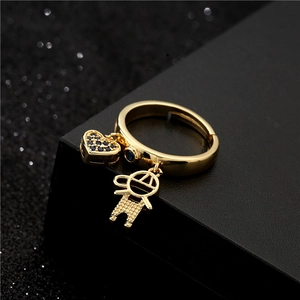 18K gold plated copper open ring featuring blue zircon heart and cartoon boy girl charms
