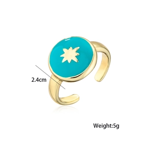 Detailed size view of an adjustable gold ring with green enamel and star motif