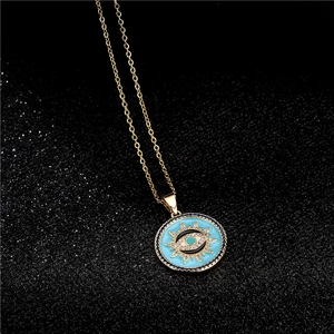 Golden Evil Eye pendant necklace with blue enamel and sparkling cubic zirconia stones