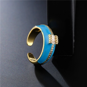 Elegant 18K gold plated open ring with sky blue enamel and sparkling baguette zircon stone