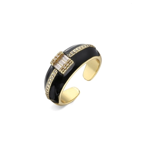 Detail of 18K gold plated ring featuring black enamel and rectangular zircon stones
