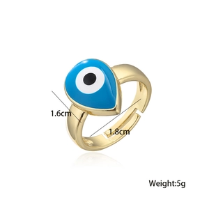 Detailed view of adjustable golden evil eye ring with blue enamel teardrop and size specs