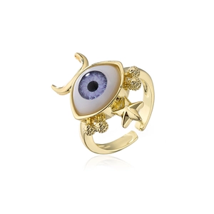 Detailed macro view of 18k gold plated evil eye ring with celestial moon and star motifs