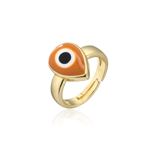Detailed macro view of gold-plated open ring with teardrop enamel evil eye element