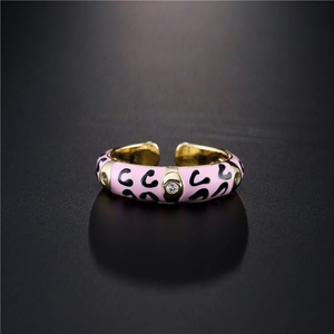 Pink enamel open ring with black pattern and sparkling cubic zirconia in gold plating