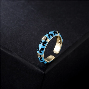 Adjustable gold plated copper ring with light blue enamel patterns and zircon stones