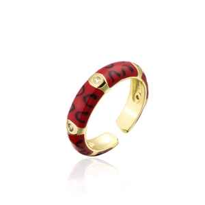 Detailed shot of gold plated open ring with red enamel and micro-set zircon accents