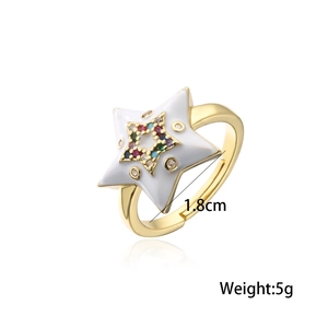 Detail view of 18K gold plated star ring with white enamel and colorful cubic zirconia