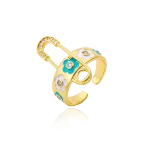 Detailed macro view of golden flower and safety pin ring with colorful enamel and zircon stones