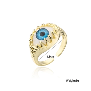 Detail shot of golden claw ring with blue evil eye showing 1.8cm diameter and 5g weight