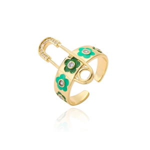 Detailed macro of gold-plated ring with green enamel flowers and paperclip motif with zircons