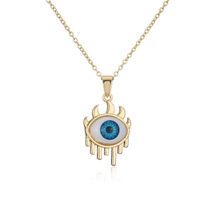 Detail of 18K gold plated necklace featuring a geometric evil eye pendant with dripping fluid design