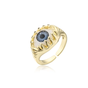 Macro view of 18K gold plated devil eye ring showing blue iris detail and claw setting