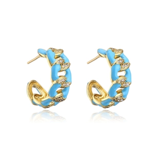 Detail of gold-plated C-shaped earrings with sky blue enamel and micro-set zircons