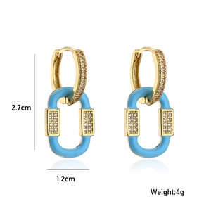 Close-up of 18K gold plated drop earrings with blue enamel and sparkling zircon pavé