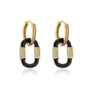 Detail of 18K gold-plated drop earrings featuring black oval links and cubic zirconia
