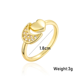 Detail of adjustable gold ring featuring a heart and cubic zirconia moon design with dimensions