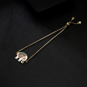 Adjustable gold elephant bracelet with white enamel and colorful cubic zirconia