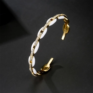 Bracelet jonc ouvert doré avec incrustations de nacre blanche et cristaux pavés