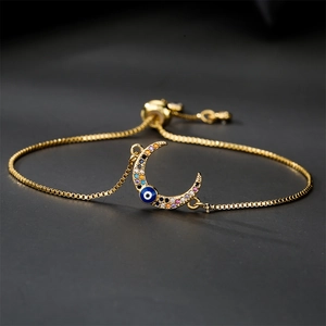 Bracelet ajustable en chaîne dorée avec croissant de lune et breloque mauvais oeil en zircon