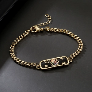 Gold plated bracelet with rectangular zircon sunburst and geometric star heart charms
