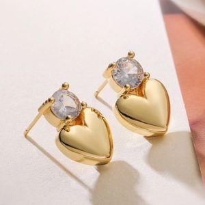Elegant 18K gold plated copper heart stud earrings featuring a round claw-set cubic zirconia