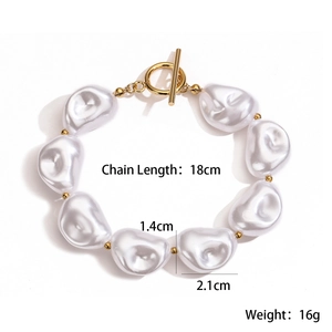 Detailed view of 18K gold plated OT clasp and irregular pearls on stylish bracelet