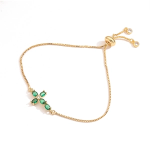 Minimalist 18K gold plated cross bracelet with green zircons and adjustable slider clasp