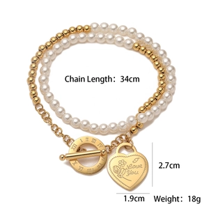 Detail of 18K gold-plated double-layer bracelet with pearls and engraved heart charm