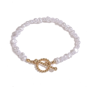Detailed macro view of baroque irregular pearl bracelet with vintage gold OT toggle clasp