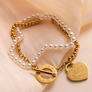 Double-layer gold heart pearl bracelet with OT buckle and Roman numeral charm