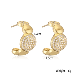 Macro detail of gold C-shaped earrings with zircon pavé and 1.9cm size measurements
