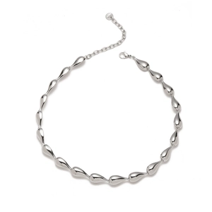 Macro detail of silver teardrop bead necklace showing lobster clasp and extender chain