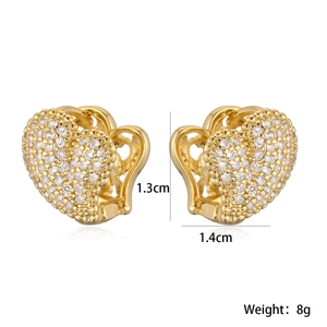 Macro shot showing 1.3cm by 1.4cm heart-shaped gold earrings with zircon inlay details