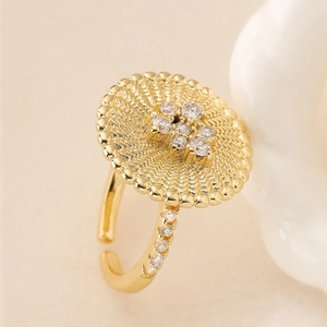 Elegant 18K gold-plated copper flower ring with textured disc and sparkling zircons