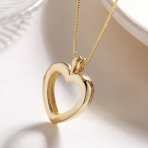 Collana con ciondolo a cuore apribile in oro 18K e catenina veneziana