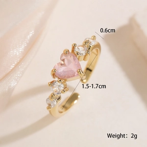 Detailed view of 18K gold plated heart ring with pink zirconia and measurement specs