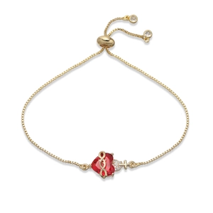 Bracelet ajustable plaqué or avec un zircon cœur rouge et un pendentif croix