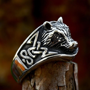 Macro shot of Viking wolf head ring in vintage stainless steel with embossed details