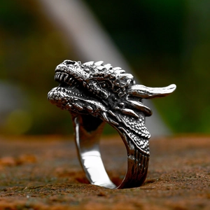 Macro side view of vintage stainless steel dragon head ring with fine scale details