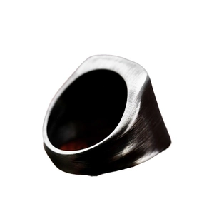 Minimalist men's dark grey stainless steel ring with industrial brushed metal texture