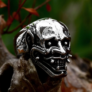 Vintage stainless steel Japanese Hannya skull mask ring for men on rustic wood