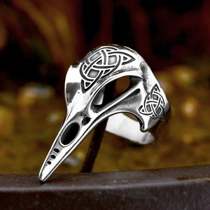 Detailed view of the vintage stainless steel raven skull ring with Celtic knot carvings