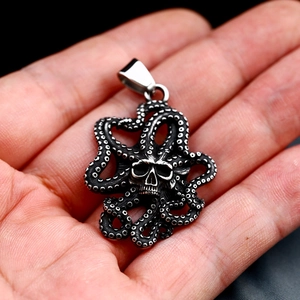 Macro shot of vintage octopus skull pendant in aged steel finish with detailed tentacles