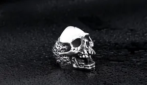 Detail shot of gothic skull ring with vintage silver finish and honeycomb texture