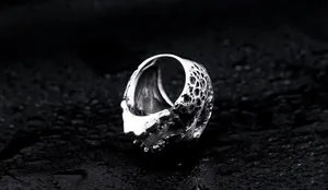 Macro shot of silver punk ring with irregular rock texture and gothic industrial finish