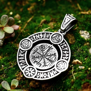 Vintage stainless steel Viking Vegvisir compass pendant with runes on mossy background