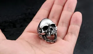 Macro detail of gothic skull ring in vintage titanium steel with side honeycomb etching