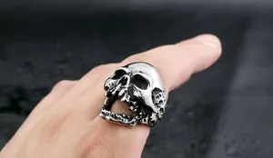 Macro shot of a punk style stainless steel skull ring with vintage silver finish for men
