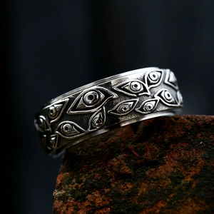 Retro stainless steel spinner ring with evil eye relief and oxidized silver finish